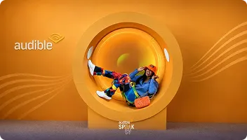 Audible Trade Show Photo Booth Activation Person in colorful clothes posing in bright yellow circular photo booth frame