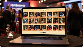 OutSnapped Photo Booth Digital Gallery Display Laptop displaying OutSnapped photo gallery grid with guest portraits at branded event