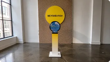 Custom Branded Mirror Booth Interactive branded photo booth with yellow top and blue globe