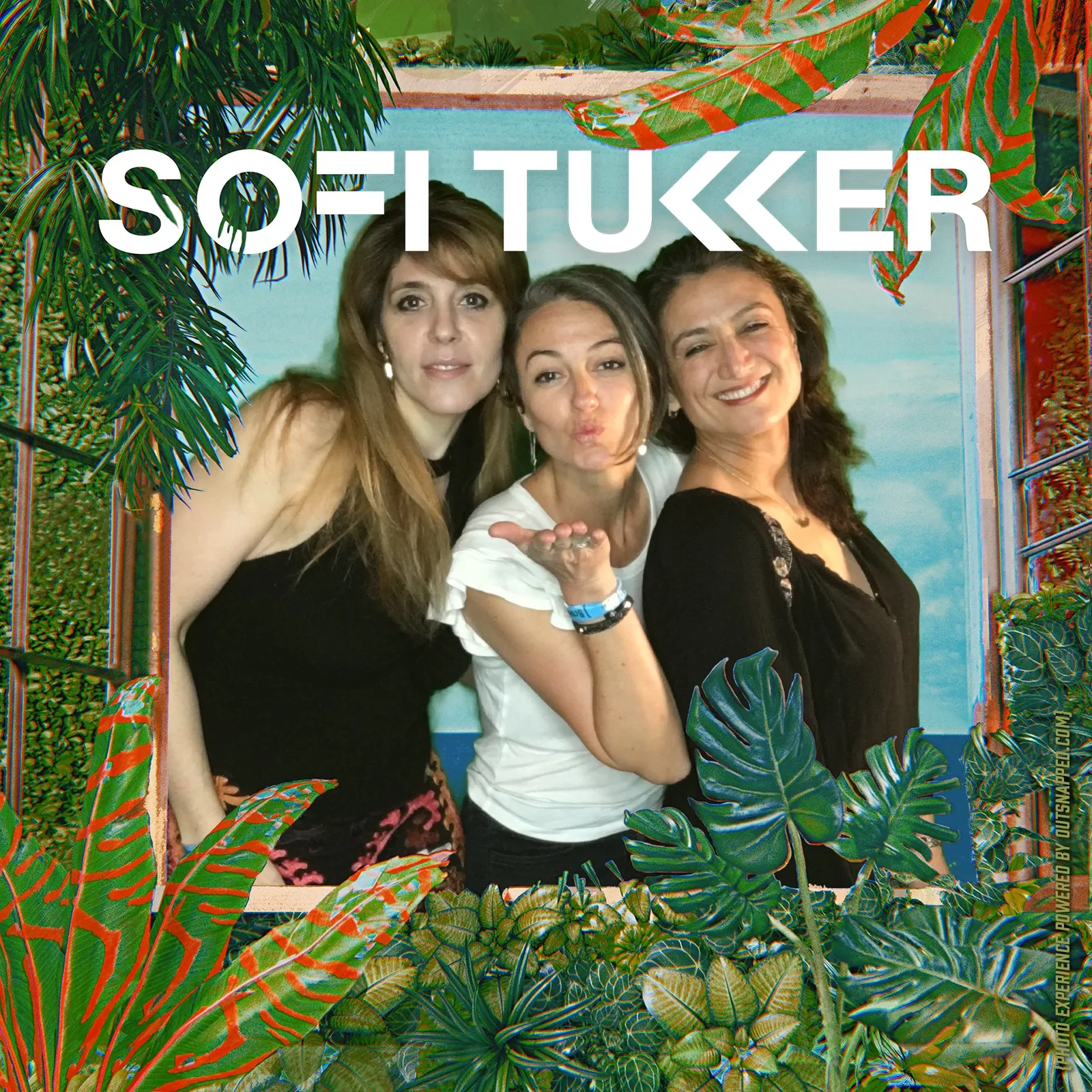 Sofi Tukker Concert Photo Booth Three concert-goers posing in a Sofi Tukker branded jungle-themed photo booth frame