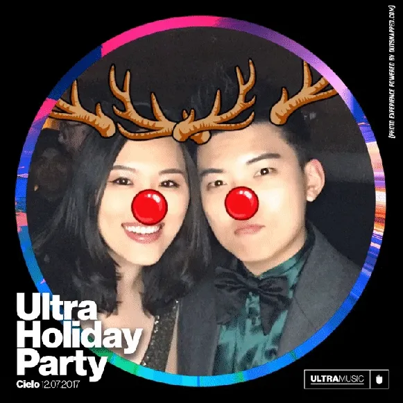 Couple with photo booth reindeer antler and red nose filters
