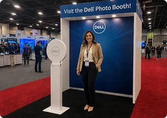 Woman posing at Dell-branded photo booth at trade show event