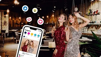 Instant Photo Sharing at Events with OutSnapped App Two women in elegant dresses at an upscale event venue with FotoRover roaming booth capturing their photo on a mobile device display showing instant sharing options