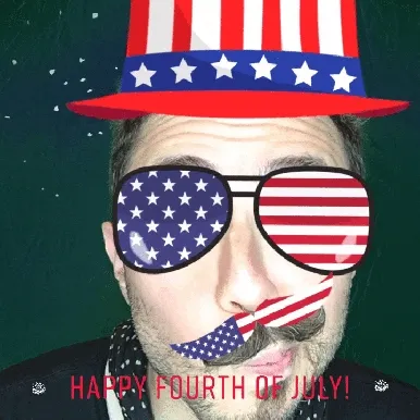 Man with patriotic hat, sunglasses, tie, and firework effects giving thumbs up