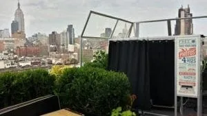 Magbooth on NYC rooftop overlooking Empire State Building skyline