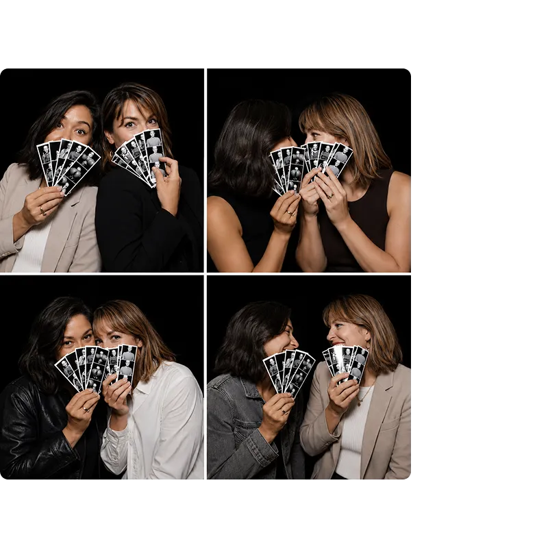 Four women holding photo strips with multiple poses from photo booth session