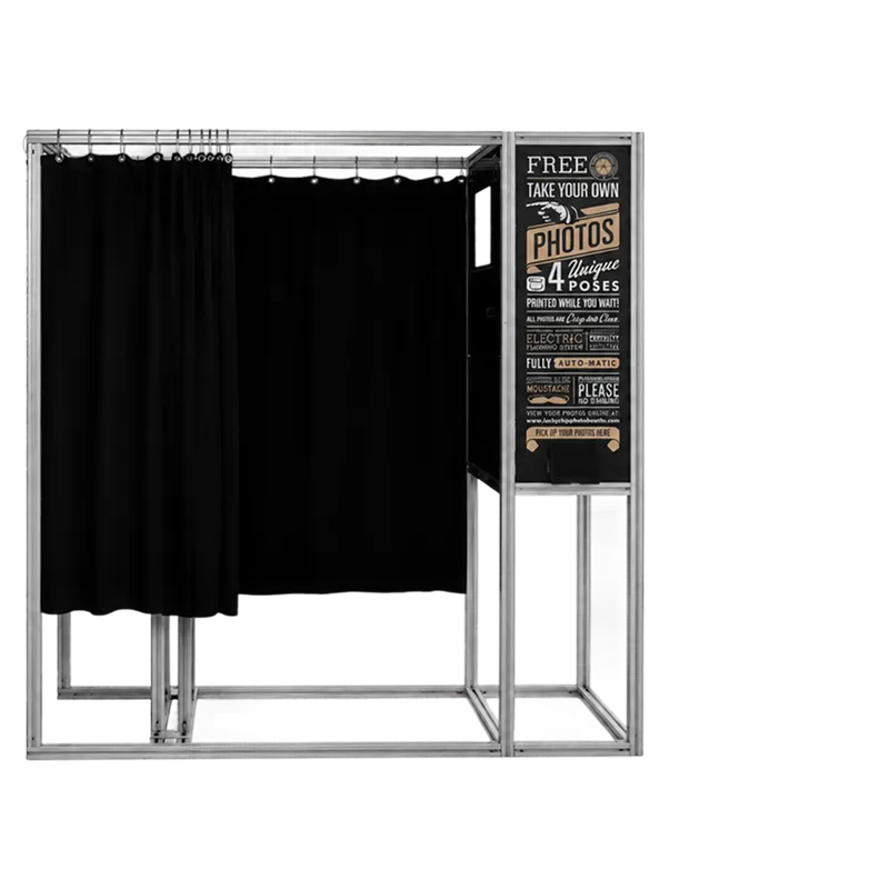 Retro enclosed photo booth with black curtain, metal frame, vintage signage