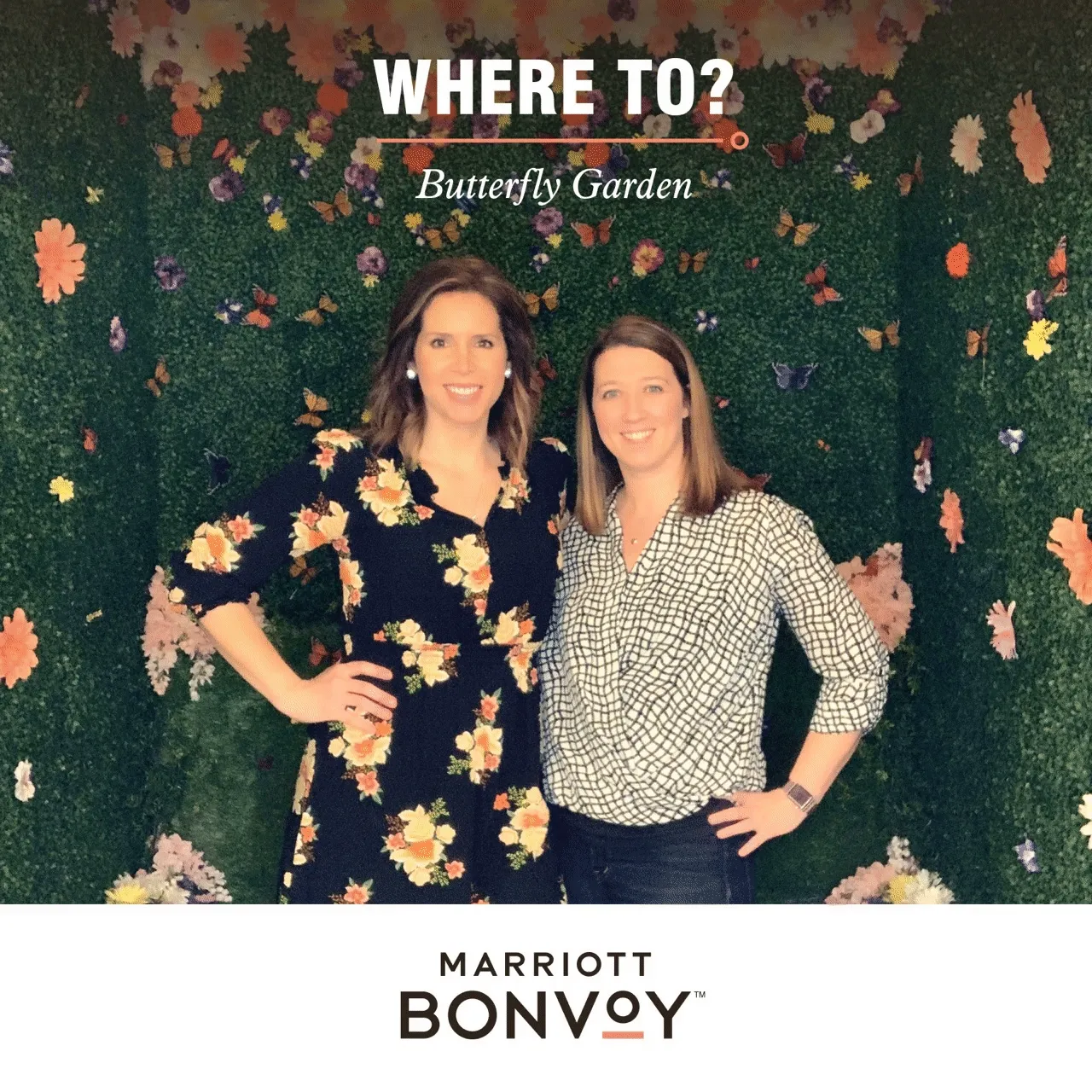 Marriott Bonvoy Butterfly Garden Photo Booth Two women posing at Butterfly Garden backdrop with green moss wall and colorful paper flowers during Marriott Bonvoy brand activation.