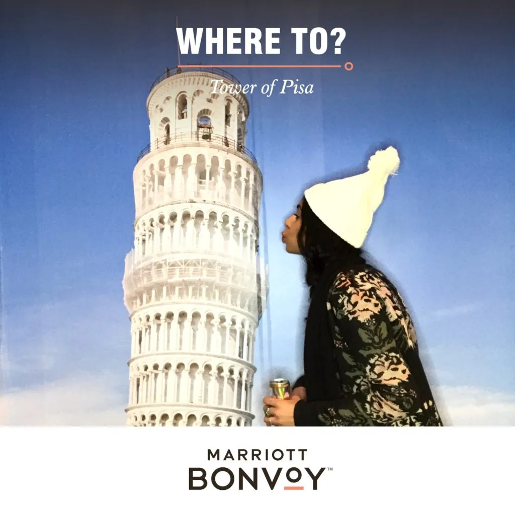 Marriott Bonvoy Tower of Pisa Travel Photo Booth Marriott Bonvoy photo booth experience with Tower of Pisa backdrop and travel theme prop