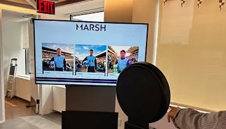 Photo Booth Display Kiosk – Marsh Brand Showcase Indoor photo booth display kiosk with Marsh branding showing three staged photos on digital screen