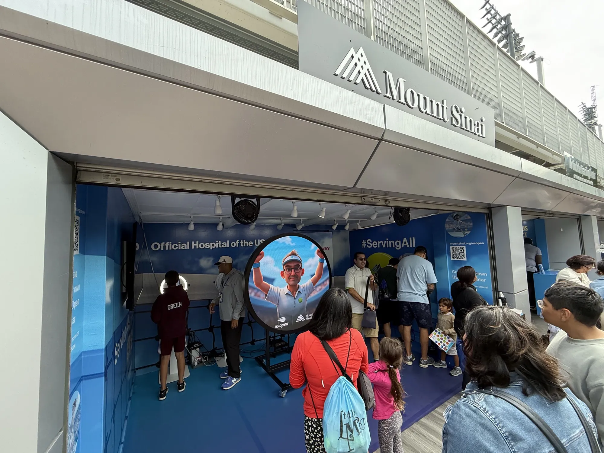 Mount Sinai US Open Sponsor Activation Mount Sinai branded photo booth tent at the US Open with fans lining up under the Official Hospital signage