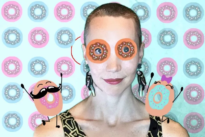 OutSnapped Donut Photo Booth Filter Person with donut-themed face art featuring orange sprinkled donuts for eyes, surrounded by pink and blue frosted donuts on a pastel background