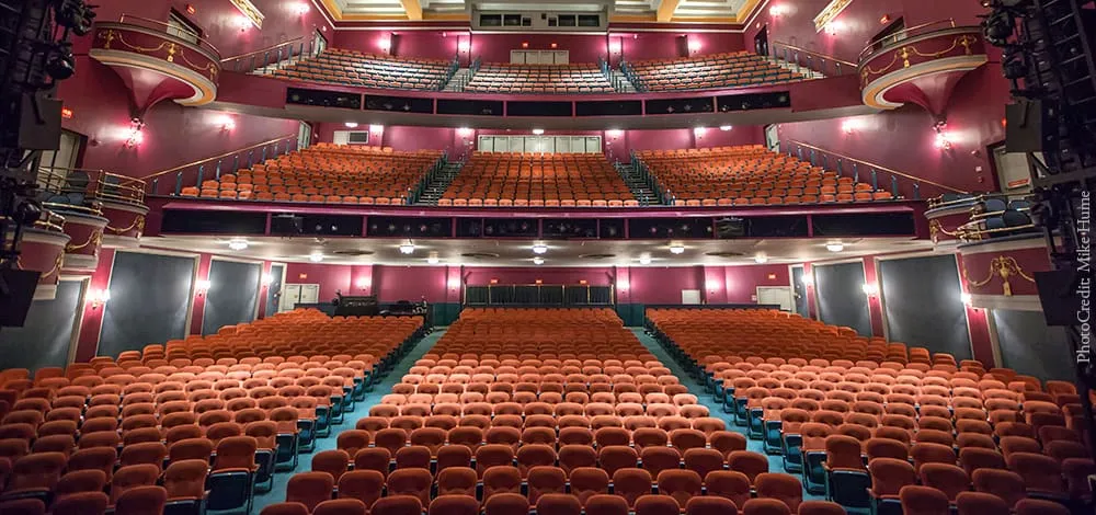 National Theatre Washington DC Auditorium Interior Historic theatre auditorium with multiple levels of orange seats and ornate railings