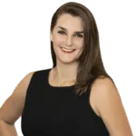 Olyvia Salyer - Testimonial Headshot Woman with shoulder-length brown hair in black sleeveless top smiling