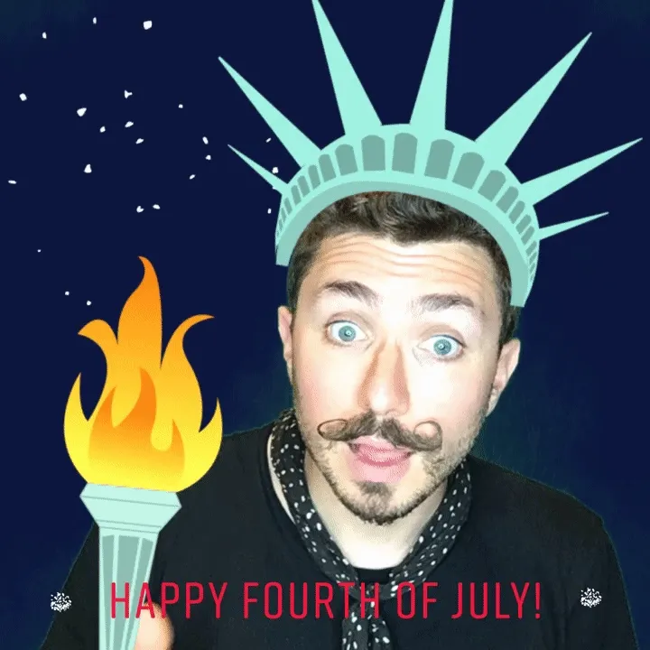 Man wearing Statue of Liberty crown and holding torch with animated flame, smiling at camera against dark blue background with 'Happy Fourth of July!' text