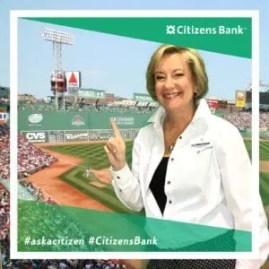 Professional in white blazer giving thumbs up in Citizens Bank photo frame