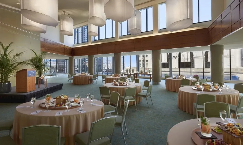 an event ballroom at Seaport Hotel with floor-to-ceiling windows, 25-foot ceilings, and Boston Harbor views