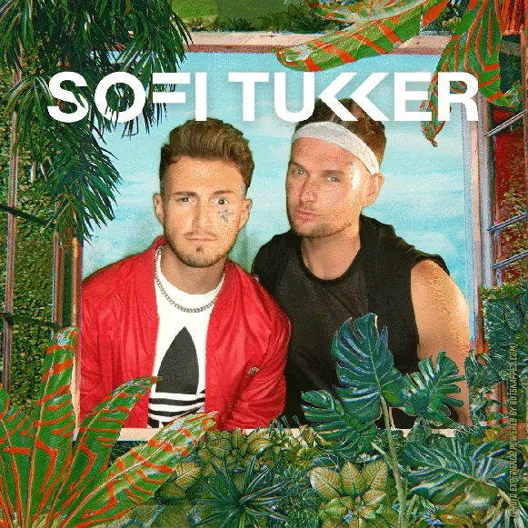 Sofi Tukker Treehouse Photo Booth Output Two men posing in OutSnapped photo booth with tropical leaf backdrop and turquoise pool behind them at Sofi Tukker Treehouse Tour event