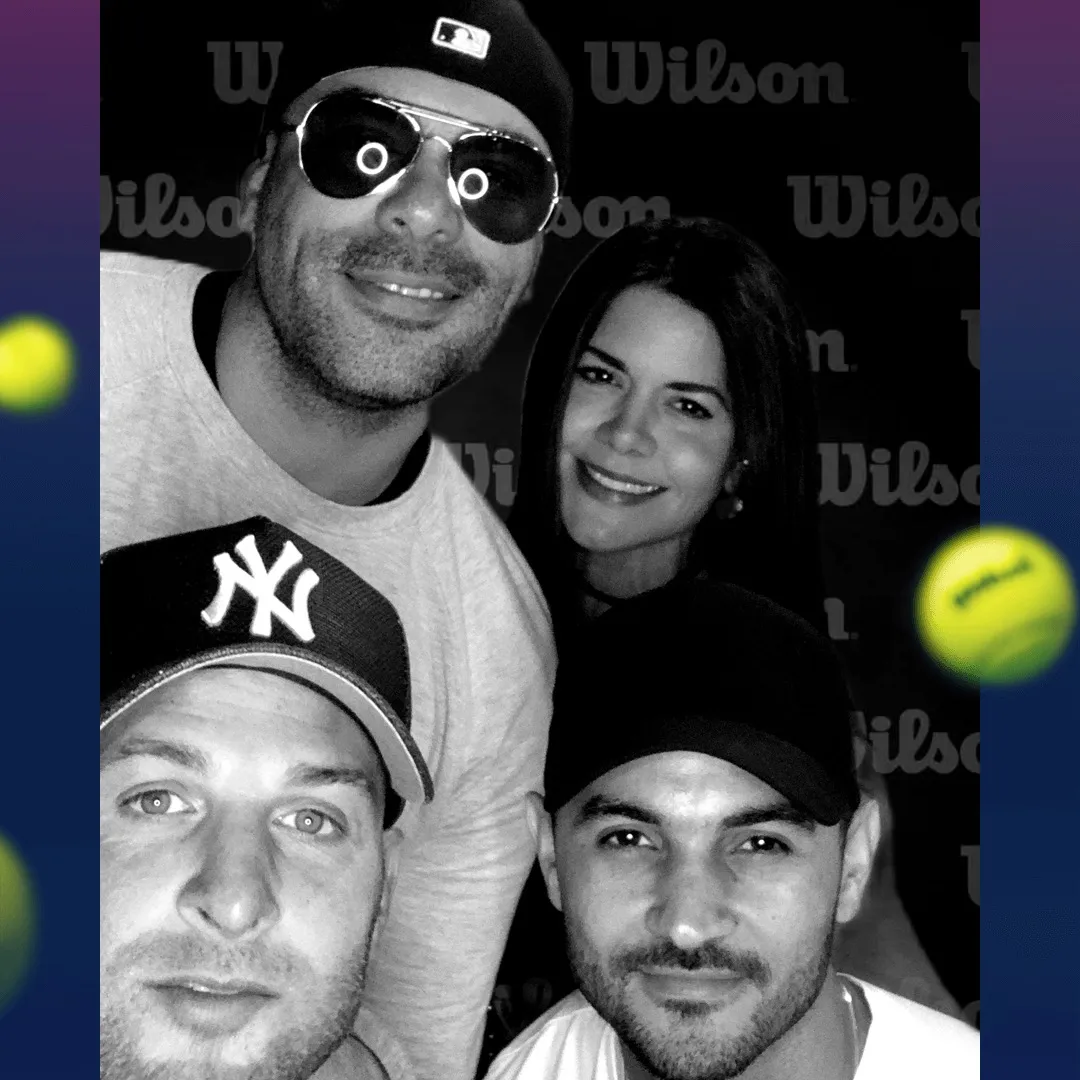 Wilson Sports Photo Booth Fan Activation Fans posing in a Wilson-branded OutSnapped photo booth at a sports event with tennis ball graphics