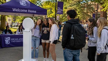 University event attendees enjoying photo booth