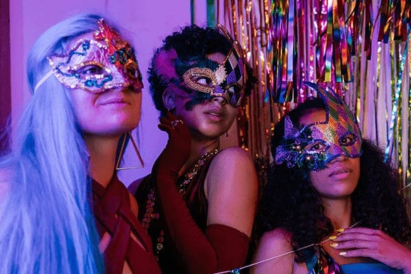 3 women in a Masquerade party