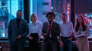 AI-transformed team photo showing five professionals in business suits sitting confidently in a modern office setting