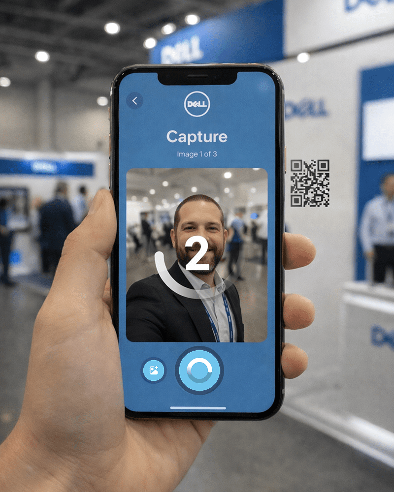 Hand holding smartphone with Dell-branded AI photo booth capture interface at event