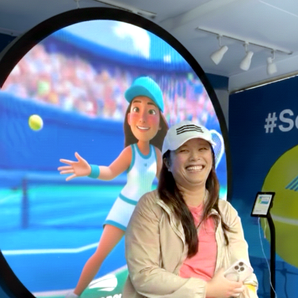 AI photo booth display wall showing transformed guest photo at live event